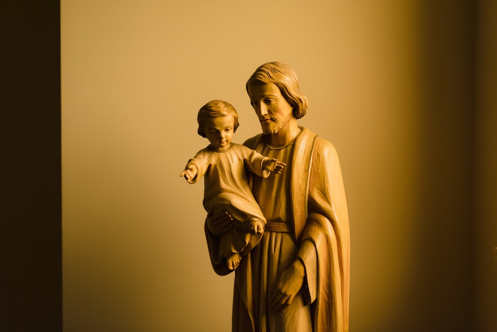 gold statue of man and woman