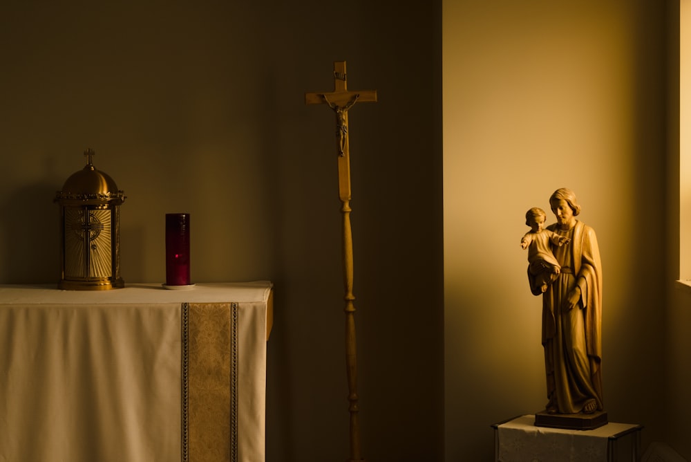 gold crucifix on white table