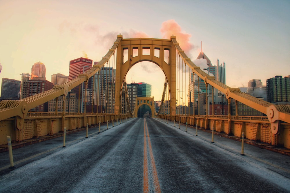 brown bridge under blue sky during daytime