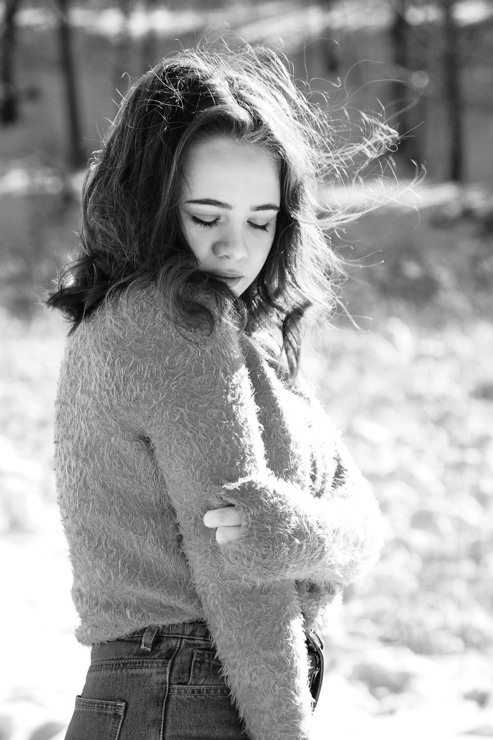 grayscale photo of woman in sweater