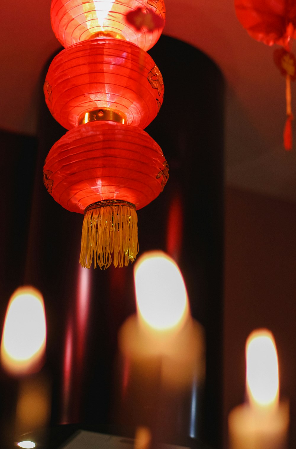 red pendant lamp turned on in room