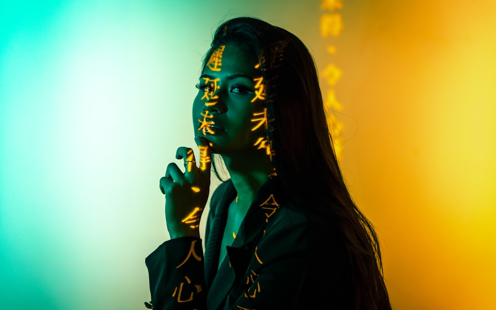 woman in black coat holding microphone