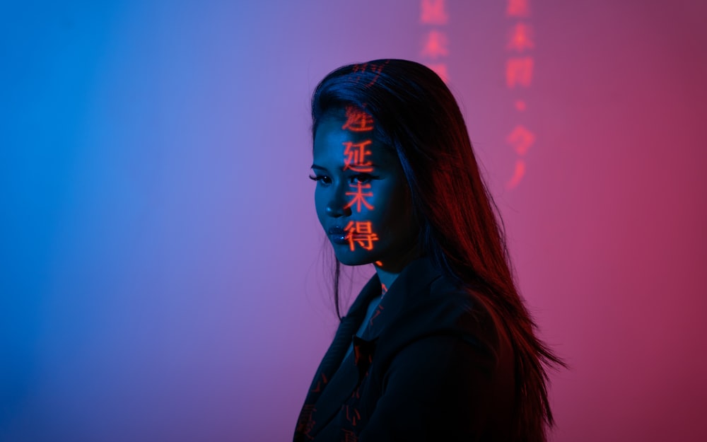 woman in black jacket with face paint