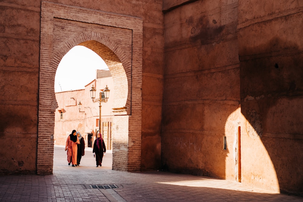 people walking on sidewalk during daytime