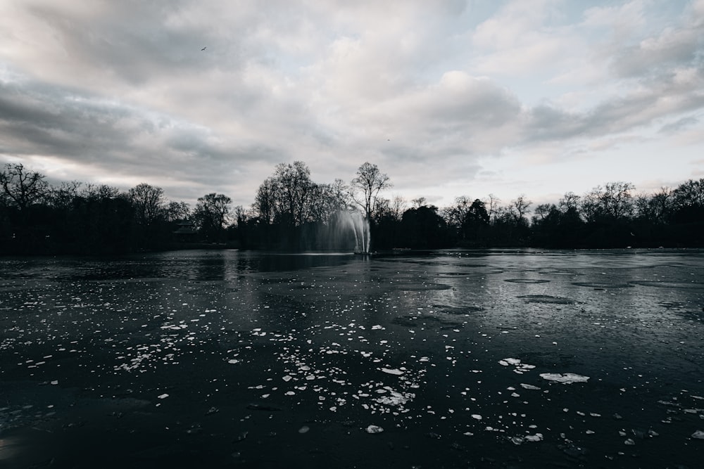 grayscale photo of water fountain