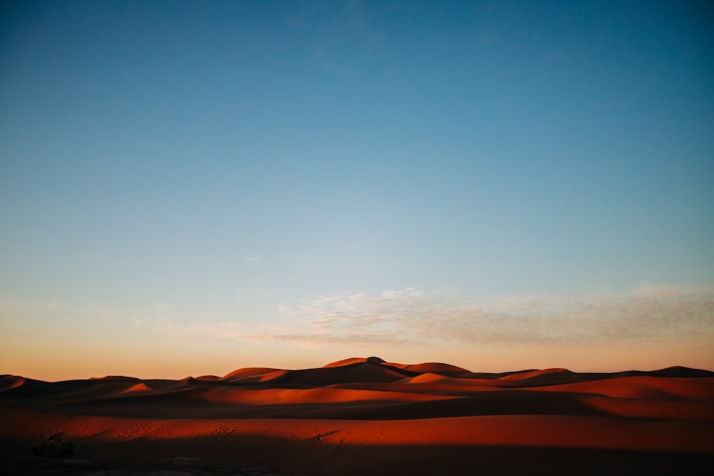 brown mountains under blue sky during daytime