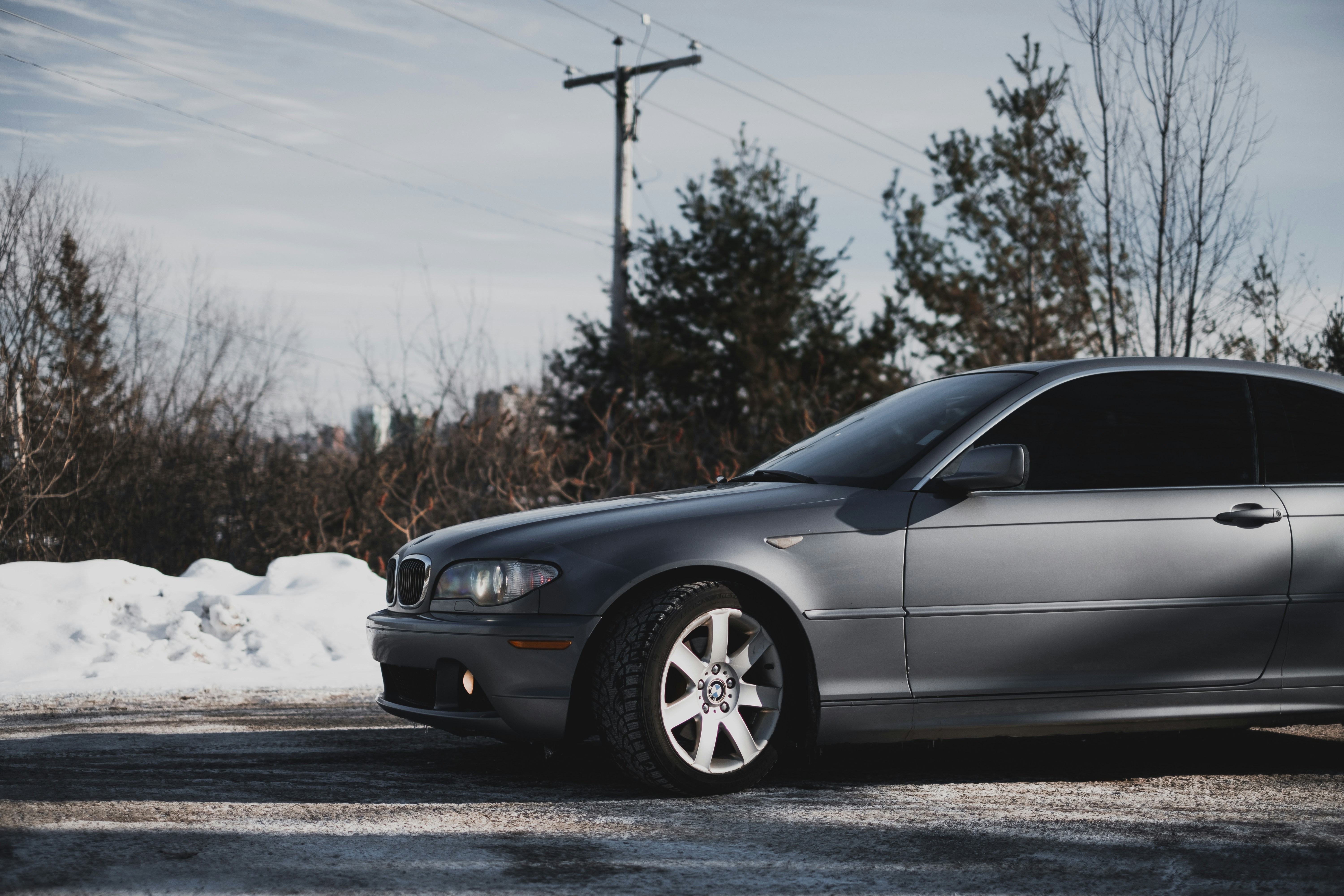 black sedan on road during daytime