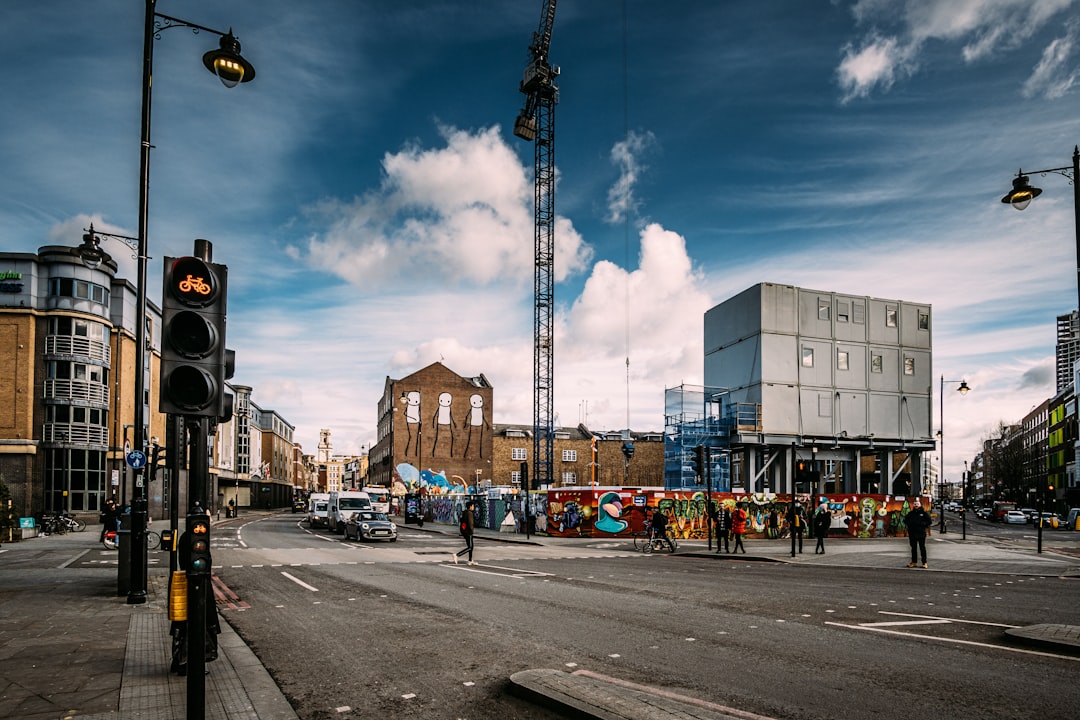 cars on road near buildings during daytime