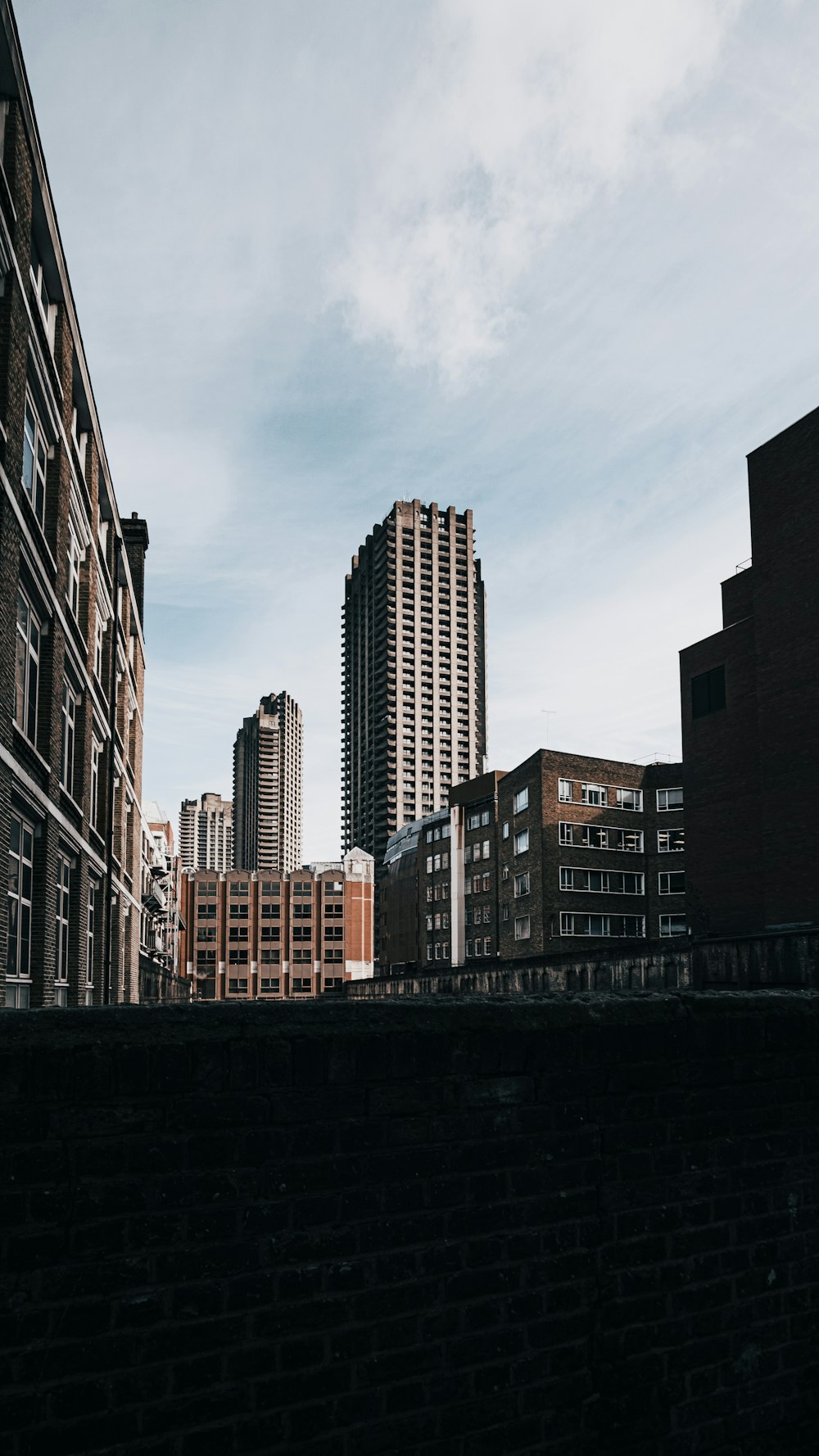 high rise buildings under gray sky