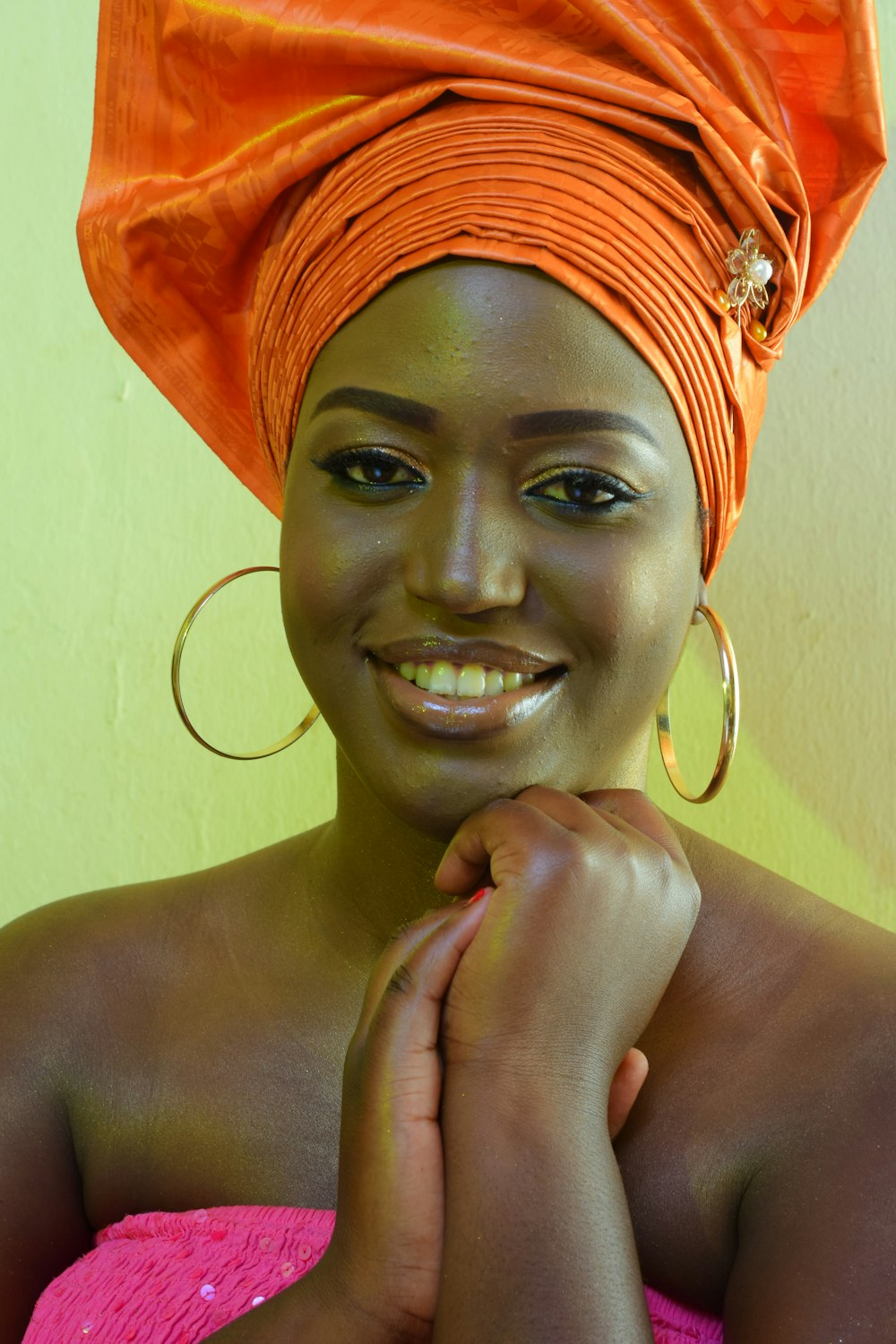 woman in orange and yellow bandana