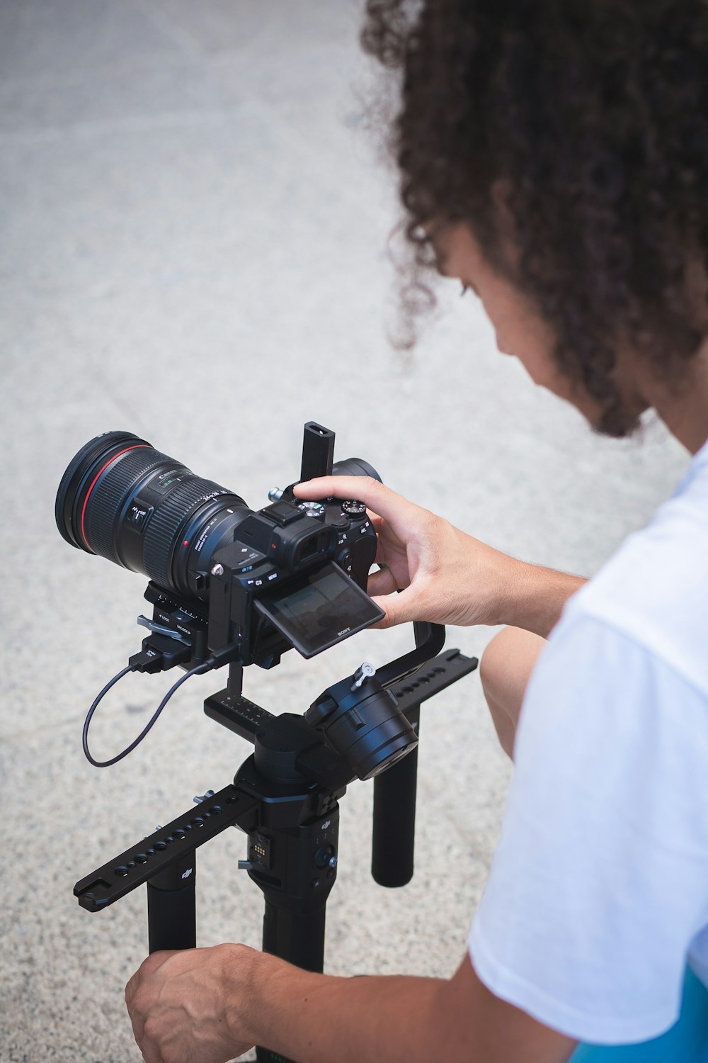 person holding black dslr camera