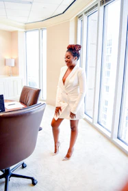 A recruiter interviewing a candidate in a bright office setting.