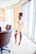 Portrait of a confident business professional in a sleek office setting with blue ambient lighting.