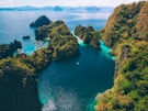 brown rock formation on blue sea during daytime