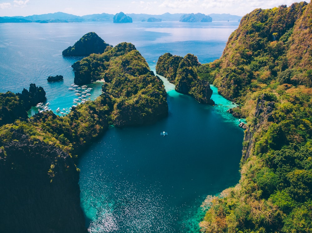 brown rock formation on blue sea during daytime