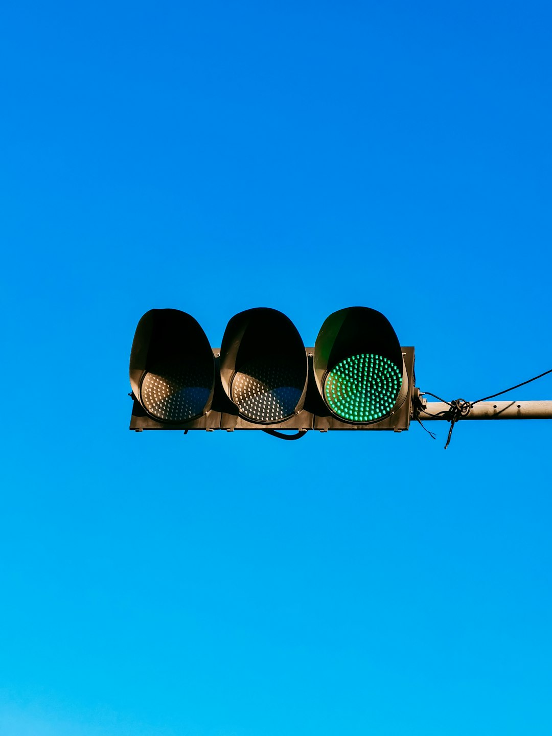 black traffic light under blue sky during daytime