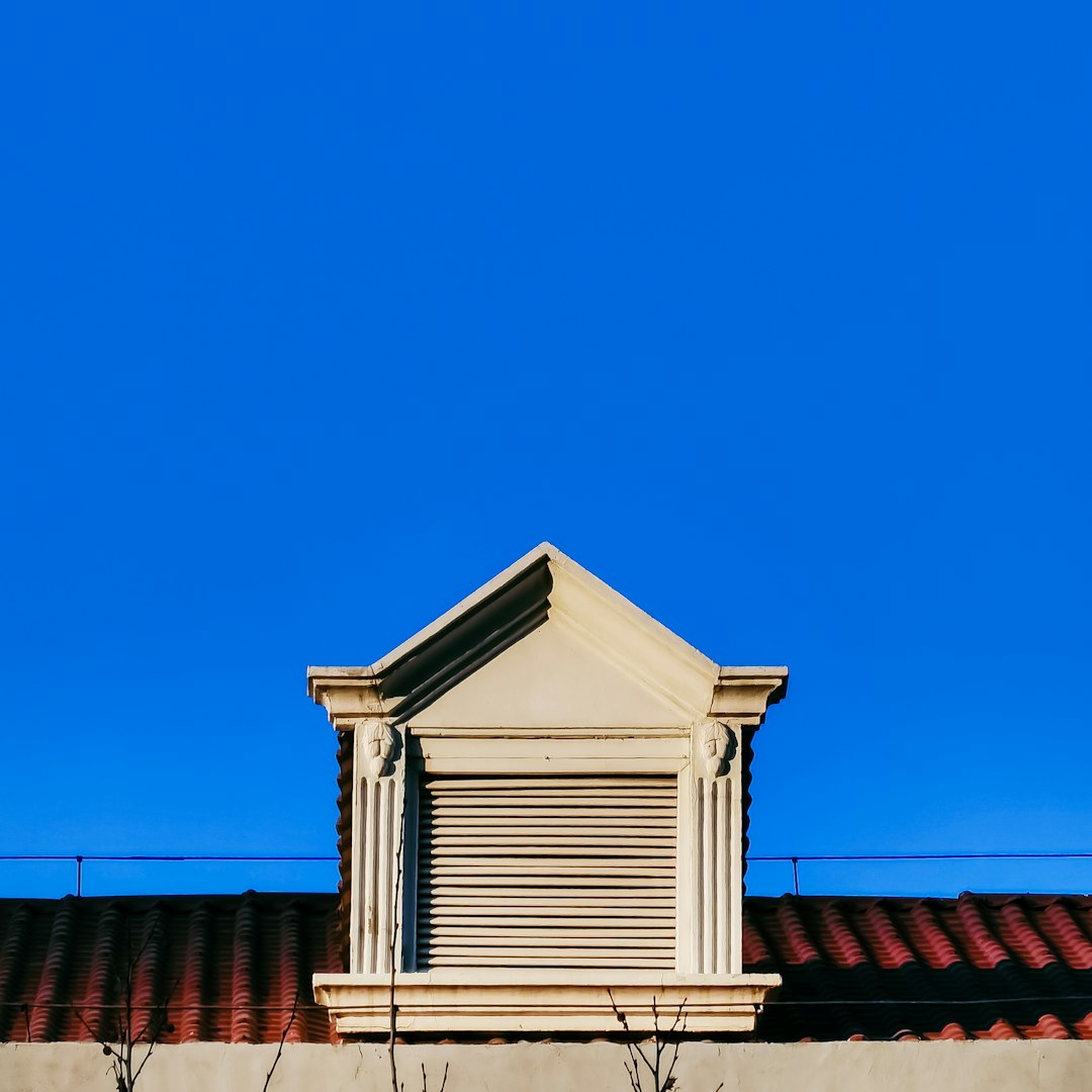 white and brown concrete building under blue sky during daytime