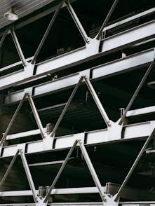 Close-up of metal beams joined together in a complex structure.