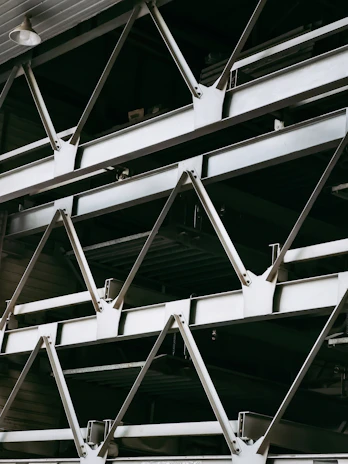 Close-up of sturdy metal beams arranged neatly in an industrial warehouse.