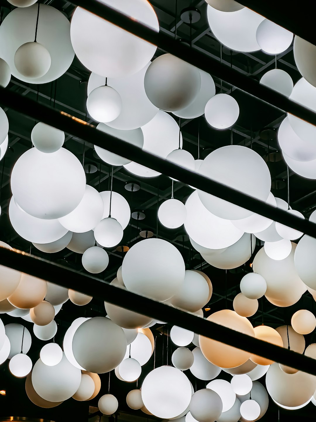 white round paper lanterns on ceiling
