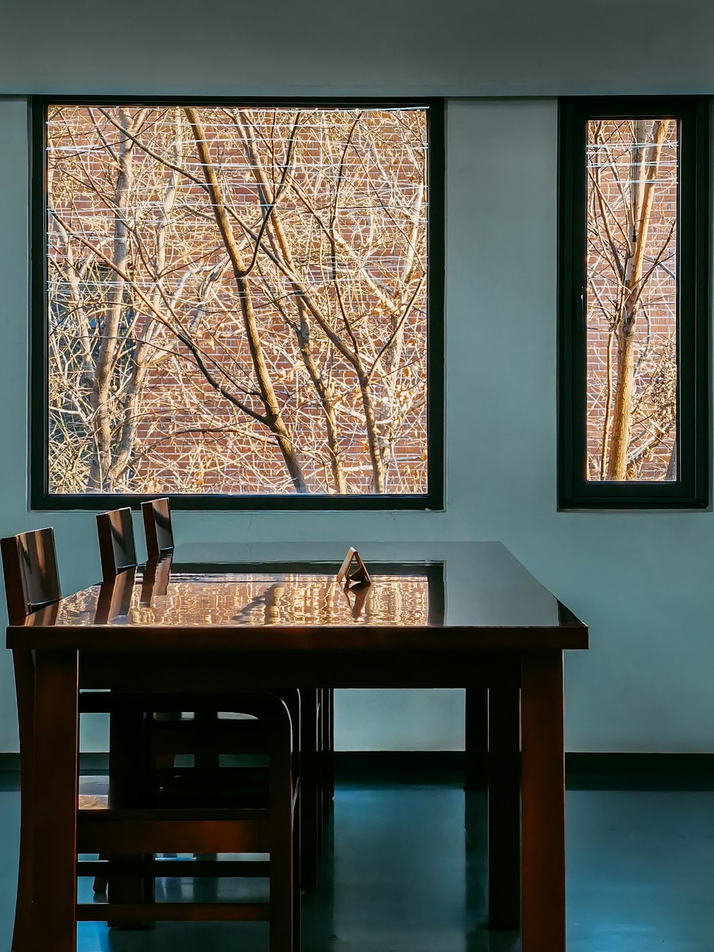 brown wooden table with chairs