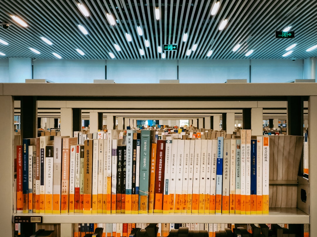 books on brown wooden shelf