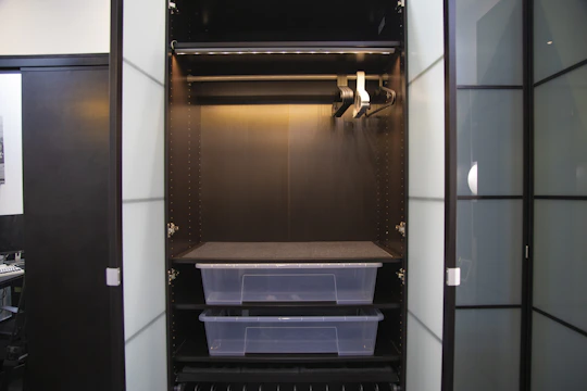 Streamlined built-in wardrobe with matte finish doors and organized interior shelving.