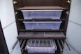 Smart storage solutions including shelves and drawers maximizing the studio space.
