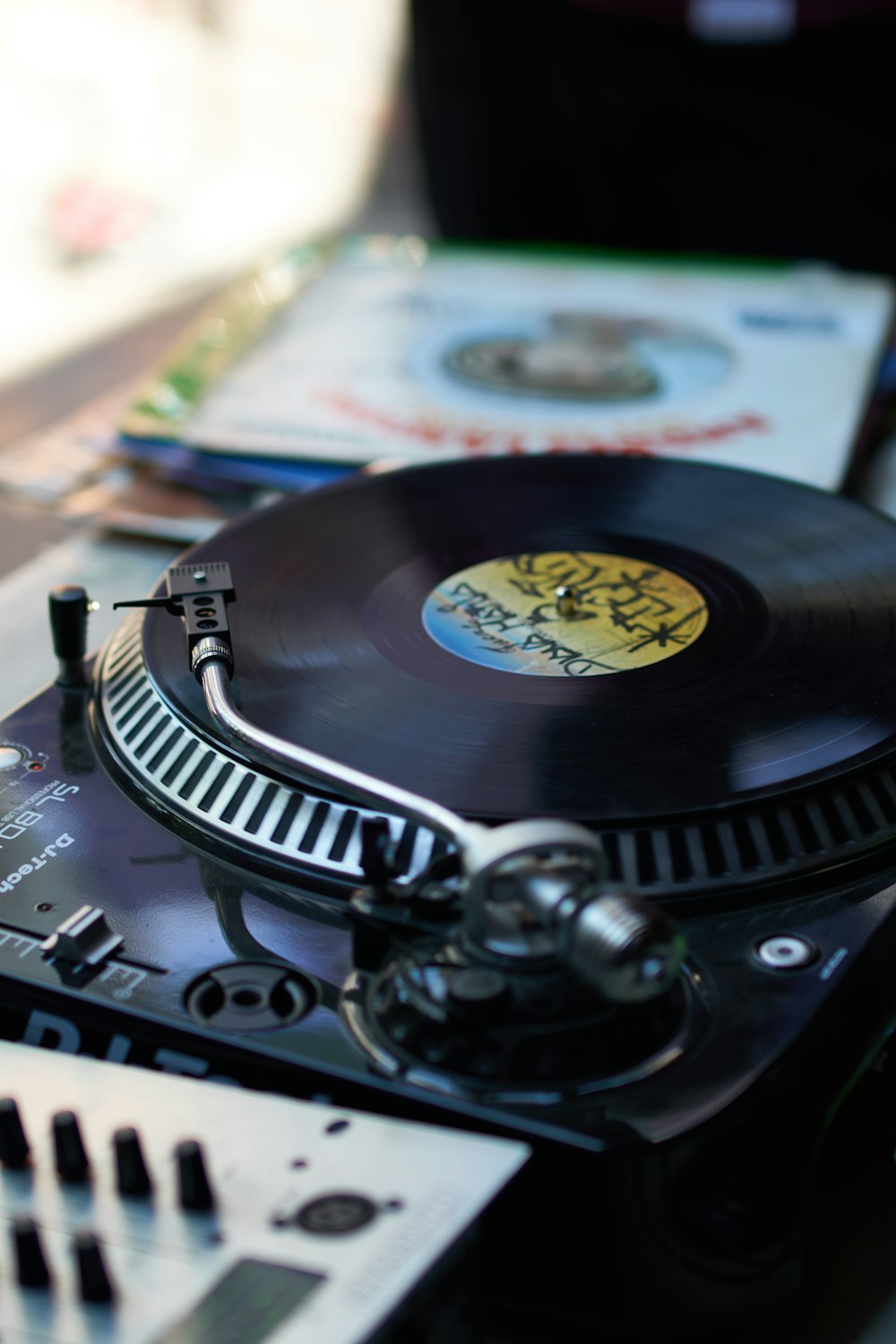 black vinyl record player on white table