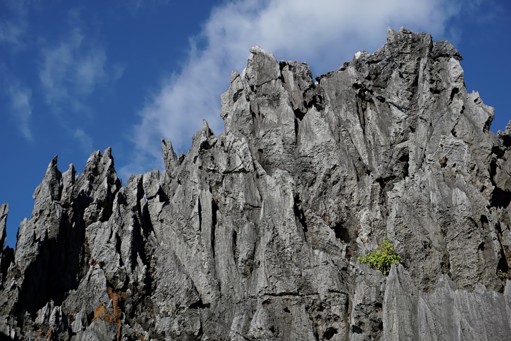 gray rocky mountain under blue sky during daytime