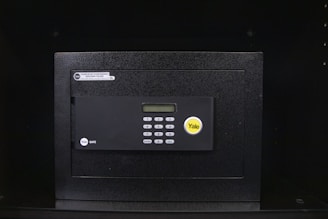A secure safe box featuring an advanced face scan lock with a blue scanning light.