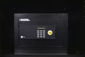 An iron safe with a sleek finish and secure lock.