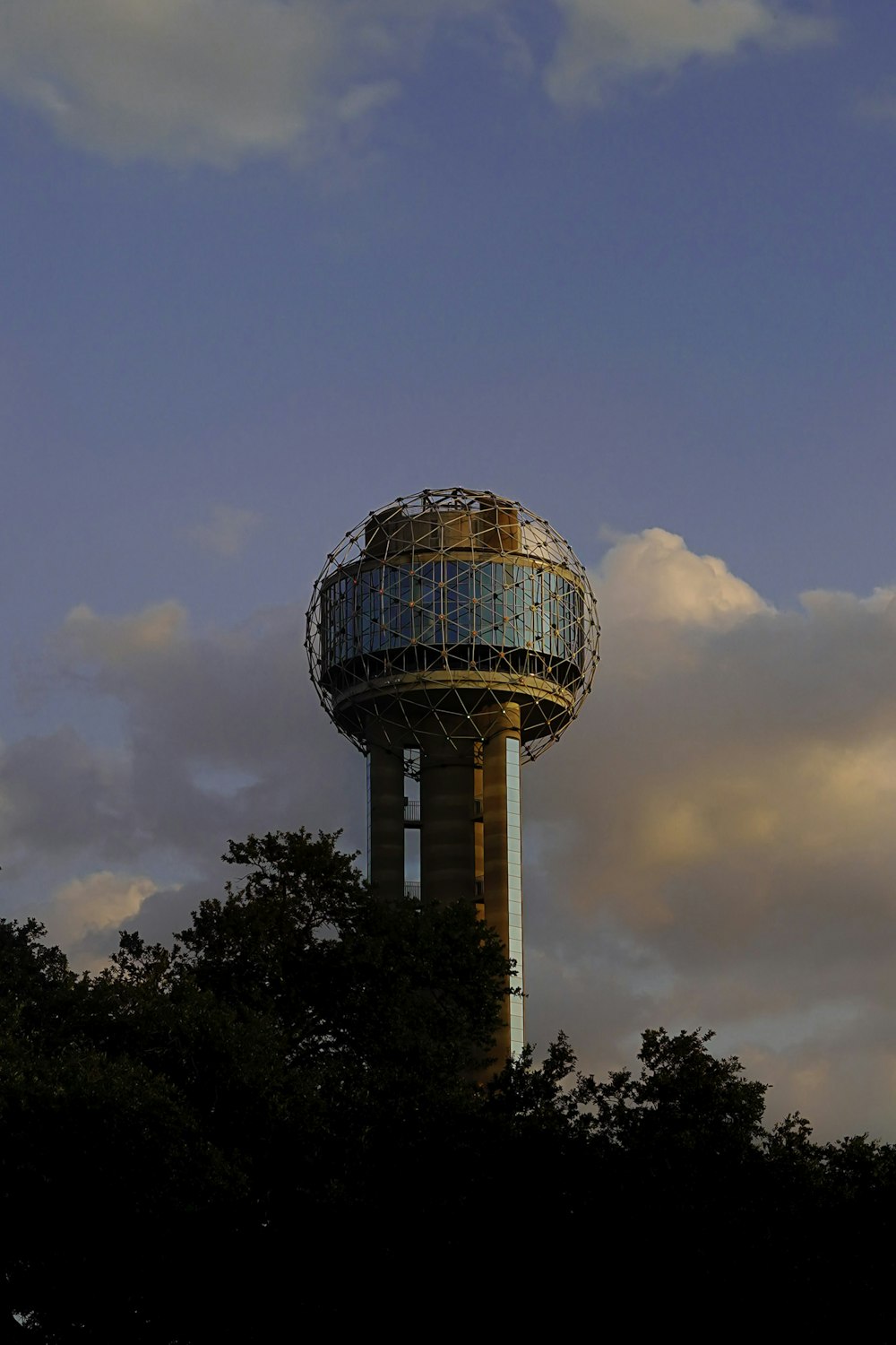 blue and white round building under blue sky