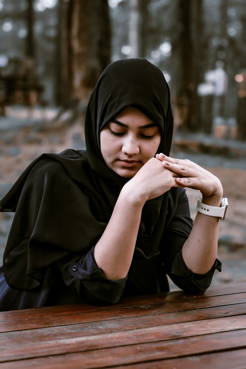 woman in black hijab and black abaya