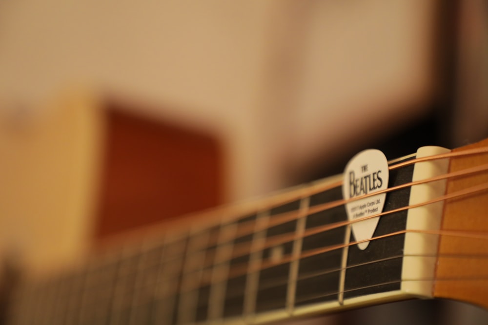 white and black guitar pick