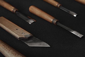 brown wooden handled knife and black knife