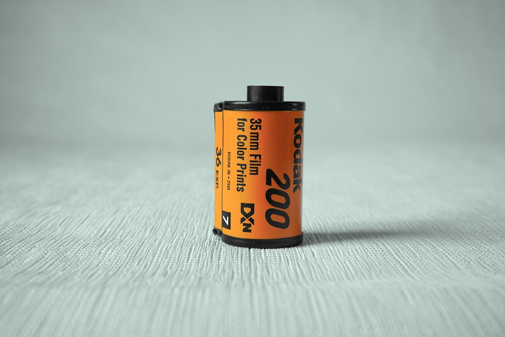 orange and black labeled can