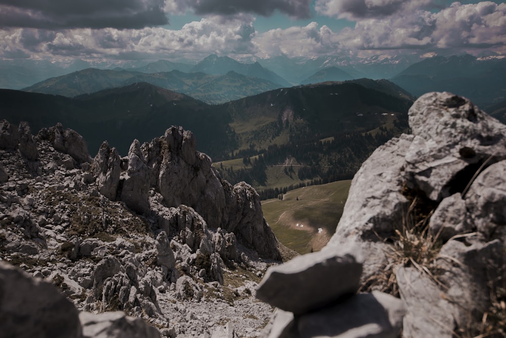 gray rocky mountain under white cloudy sky during daytime