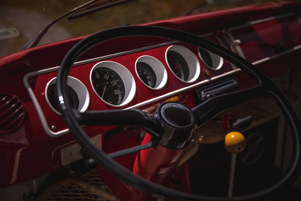 black and red car steering wheel