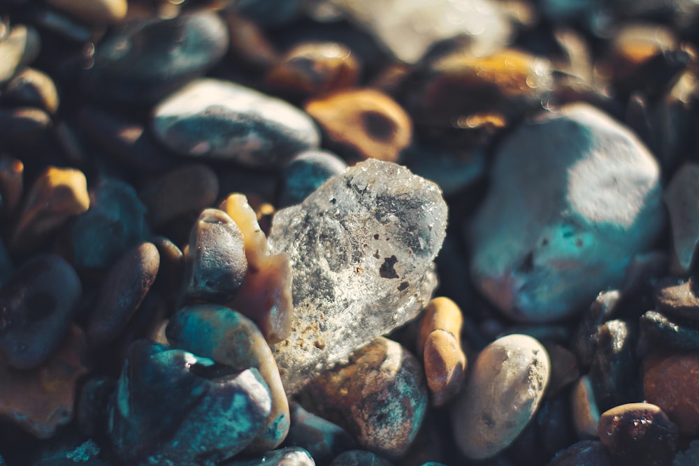 white and blue stone on water