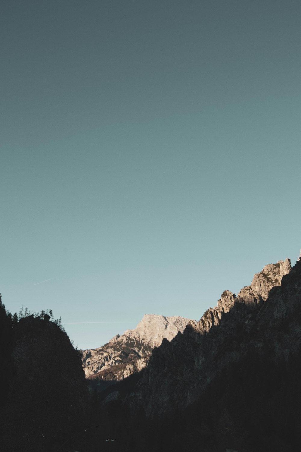 brown rocky mountain under blue sky during daytime