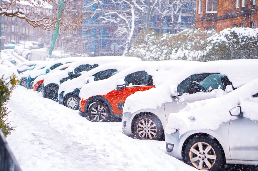 black suv covered with snow