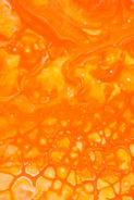 orange liquid in clear glass
