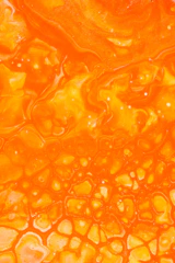 orange liquid in clear glass