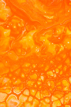 orange liquid in clear glass