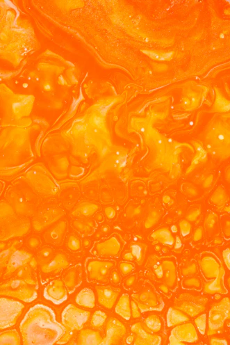 orange liquid in clear glass