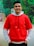 A happy customer wearing a luxurious Clozen hoodie outdoors.