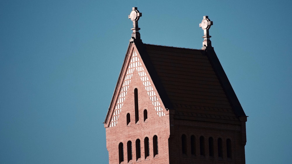 brown brick building under blue sky during daytime