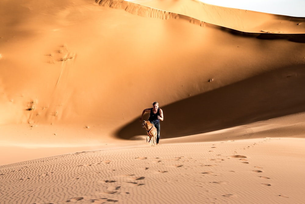 man in black jacket riding on white bicycle on desert during daytime