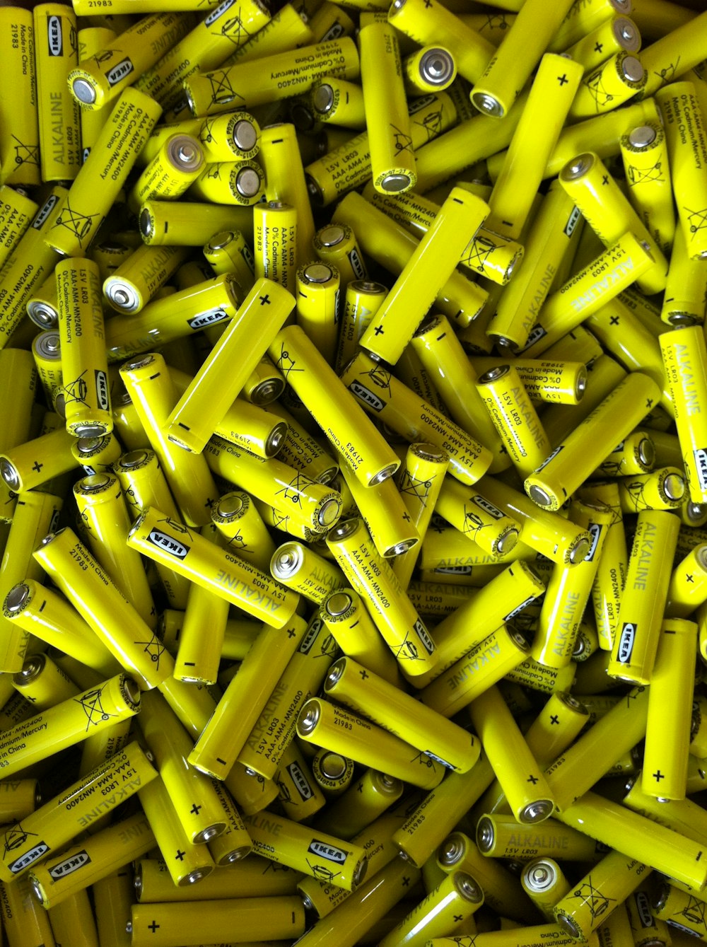 yellow plastic containers on brown wooden table